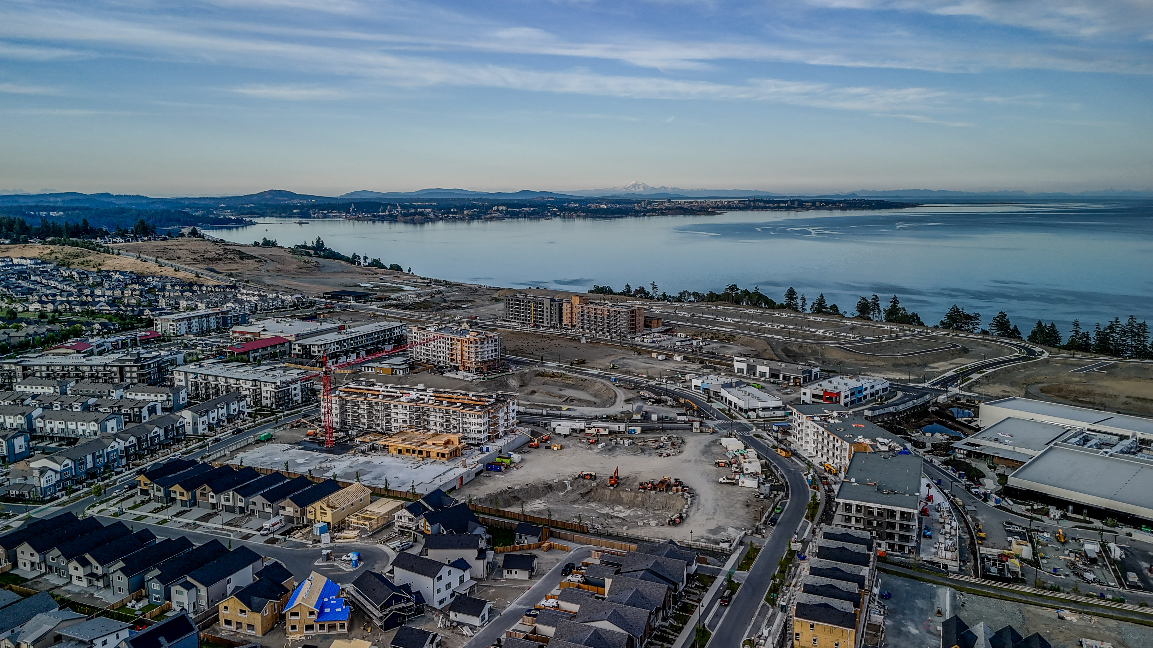 Aerial drone photo of commercial development construction Victoria BC with ocean view